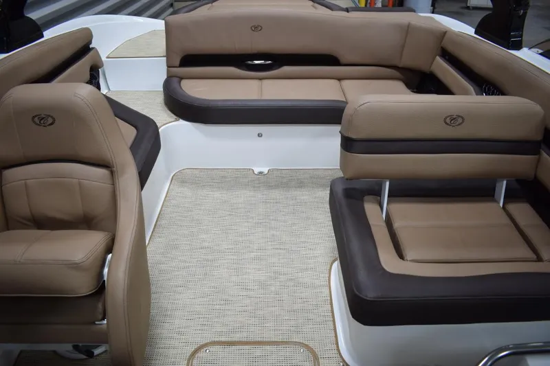 Slide: The Image of Interior of a 2019 Cobalt CS23 Surf boat with steering wheel and dashboard. - 15