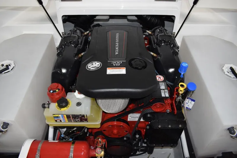 Slide: The Image of Interior of a 2019 Cobalt CS23 Surf boat with brown seating. - 17