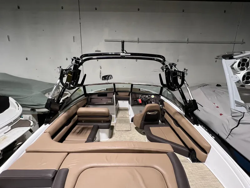 Slide: The Image of Black 2019 Cobalt CS23 Surf boat on a stand. - 4