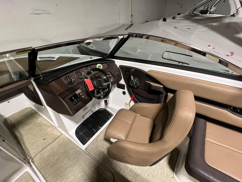 Slide: The Image of 2019 Cobalt CS23 Surf boat parked in a garage. - 5