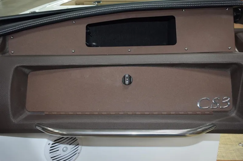 Slide: The Image of Interior view of a 2019 Cobalt CS23 Surf boat with beige seating. - 9