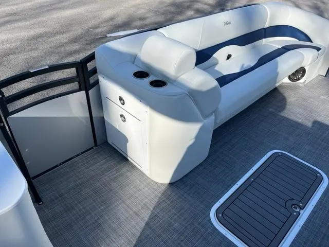 Slide: The Image of 2023 JC 25 Neptoon boat interior with cushioned seating and storage compartments. - 3