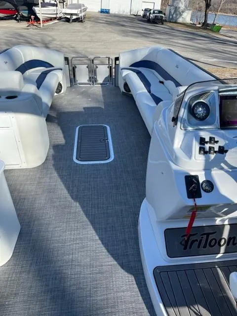 Slide: The Image of 2023 JC 25 Neptoon pontoon boat interior with seating and control panel. - 8