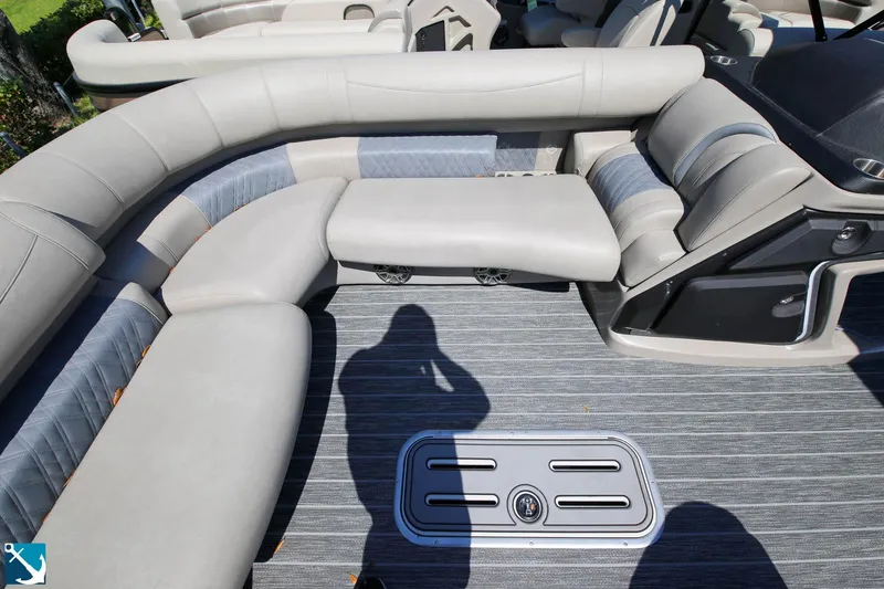 Slide: The Image of 2023 Premier 250 Intrigue RF boat interior with gray seating and flooring. - 13