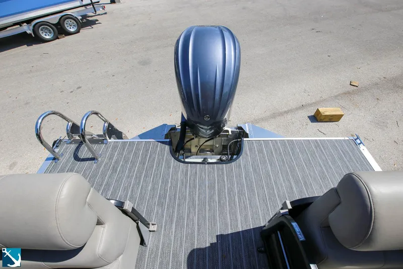 Slide: The Image of 2023 Premier 250 Intrigue RF pontoon boat with outboard motor and seating. - 15