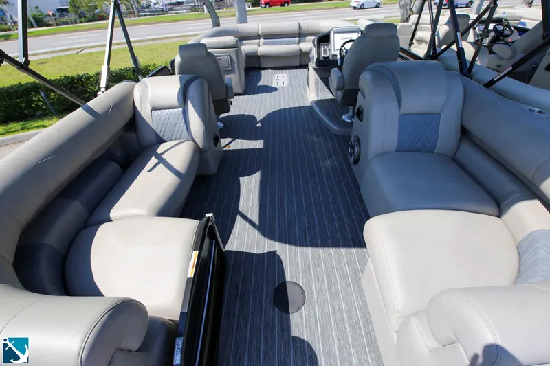 Slide: The Image of 2023 Premier 250 Intrigue RF pontoon boat interior with spacious seating and modern design. - 5