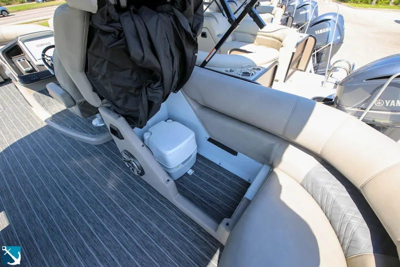 Slide: The Image of 2023 Premier 250 Intrigue RF boat interior with seating and storage. - 8
