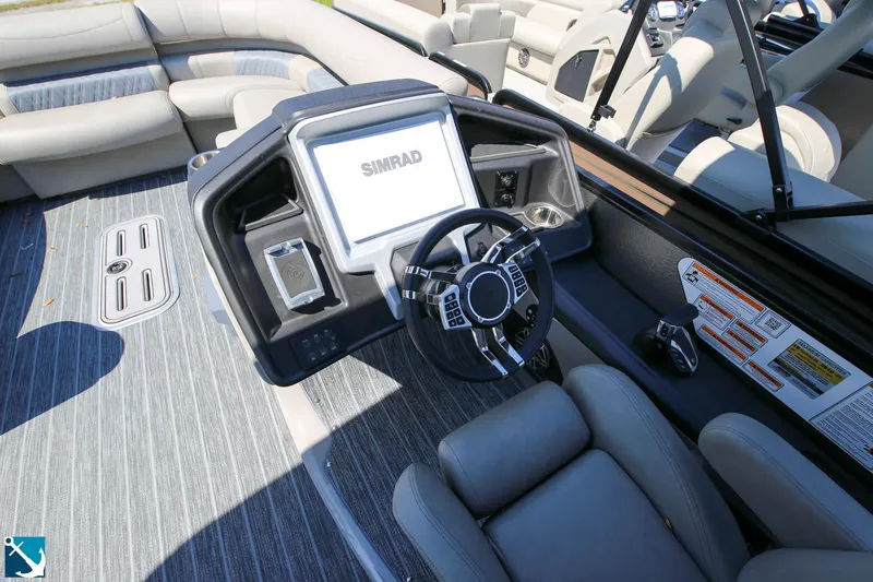 Slide: The Image of 2023 Premier 250 Intrigue RF boat interior with steering console and seating. - 9