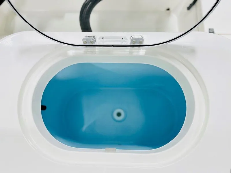 Slide: The Image of 2024 Cobia 280 CC livewell with blue interior. - 12