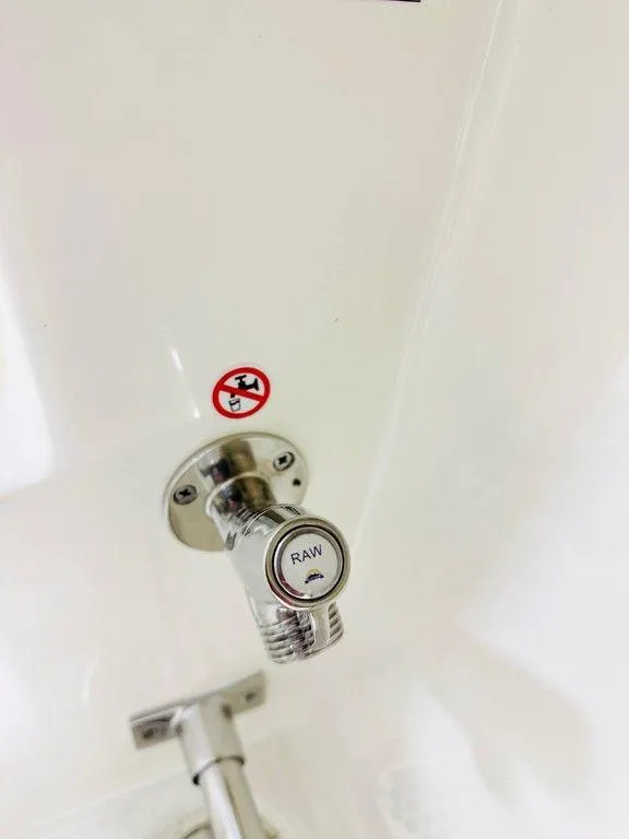 Slide: The Image of Close-up of a 2024 Cobia 280 CC boat's raw water intake valve. - 14