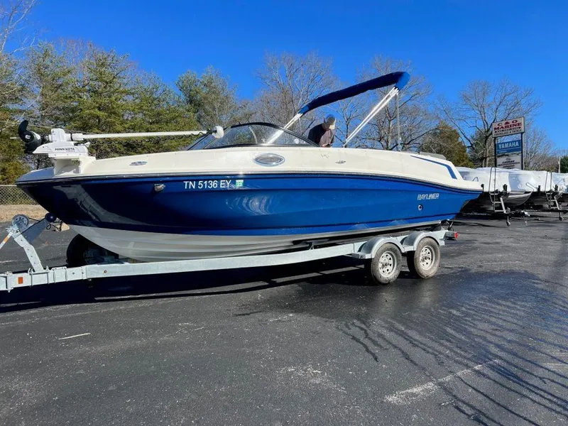 The Image of 2019 Bayliner VR6 Bowrider I/O on trailer, blue and white, parked outdoors. - 1