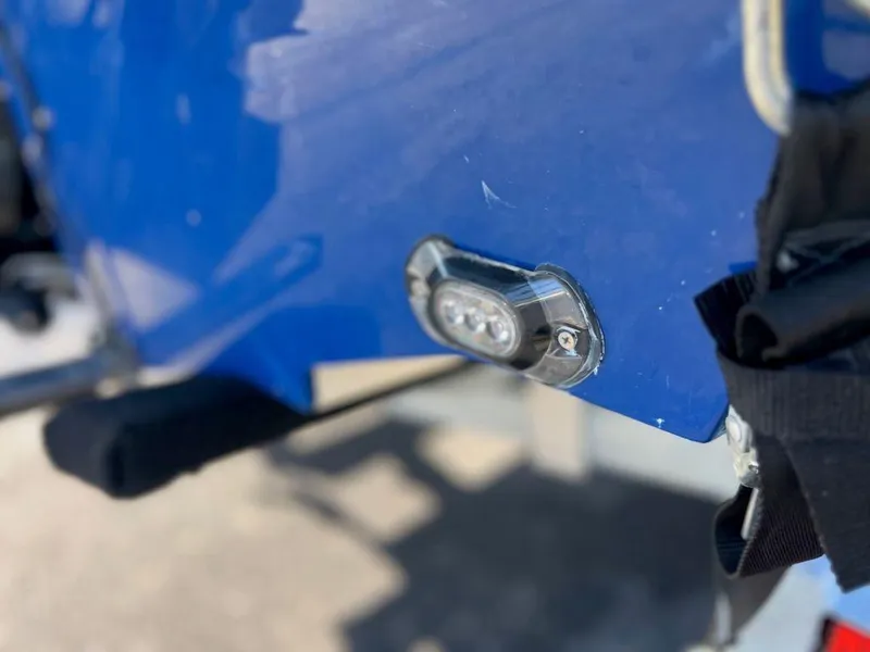 Slide: The Image of Close-up of 2019 Bayliner VR6 Bowrider I/O boat's blue hull and light fixture. - 16