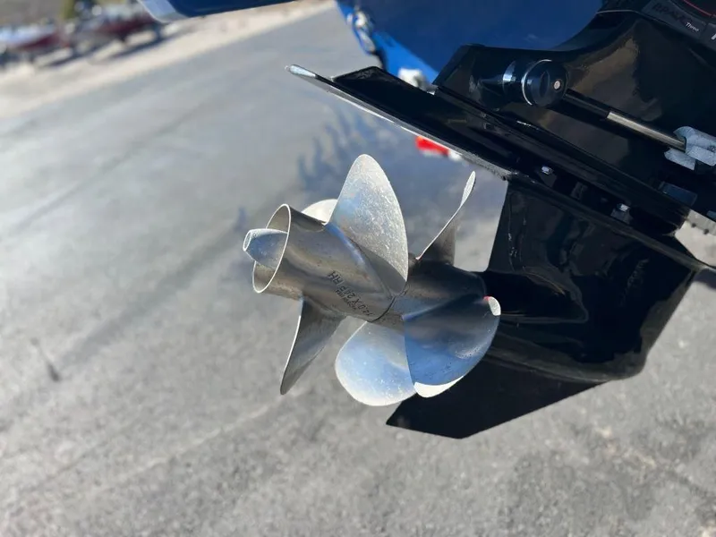Slide: The Image of Close-up of 2019 Bayliner VR6 Bowrider I/O boat propeller on pavement. - 17