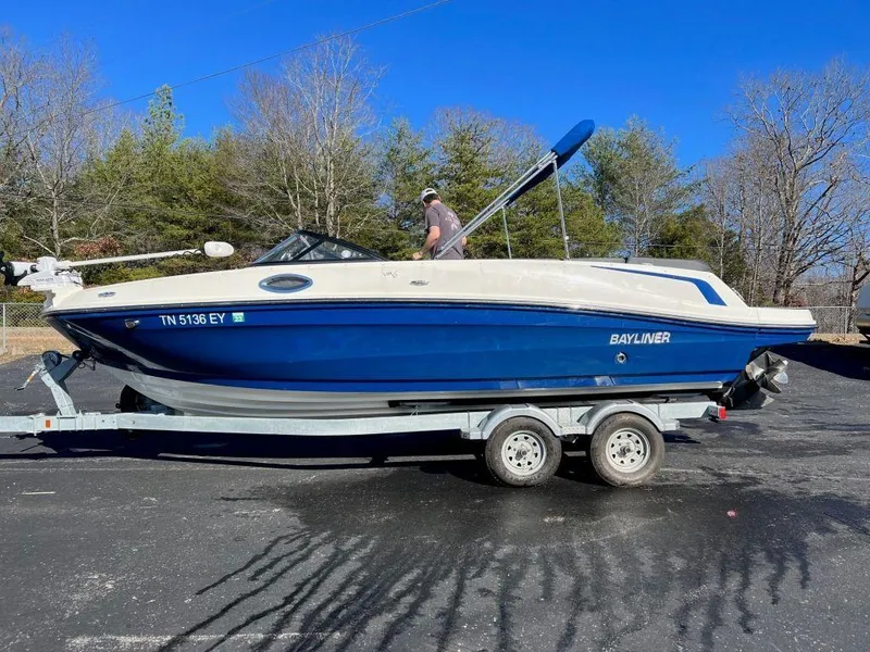 Slide: The Image of 2019 Bayliner VR6 Bowrider I/O on trailer, parked outdoors. - 6