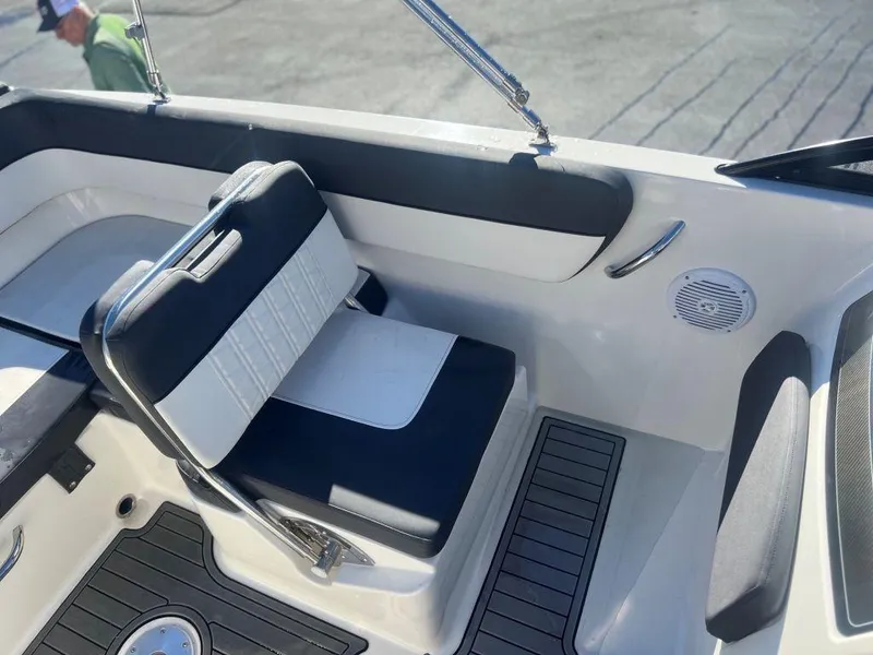 Slide: The Image of 2019 Bayliner VR6 Bowrider I/O interior with black and white seating. - 8