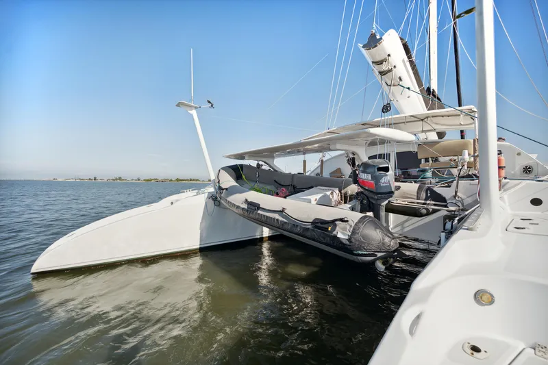 Slide: The Image of Sailing yacht Technologie Marine Entincelle 60, 1999 model, docked on calm waters. - 19