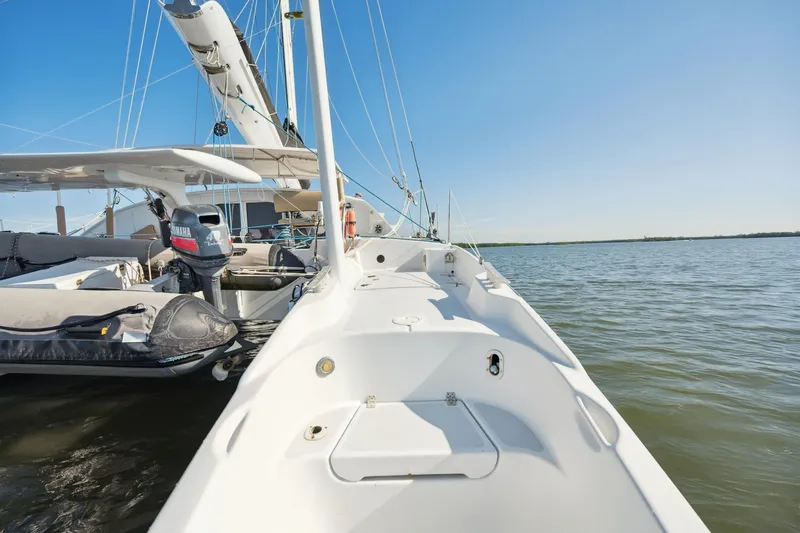 Slide: The Image of Sailing yacht Technologie Marine Entincelle 60, 1999 model, on calm waters under clear blue sky. - 20