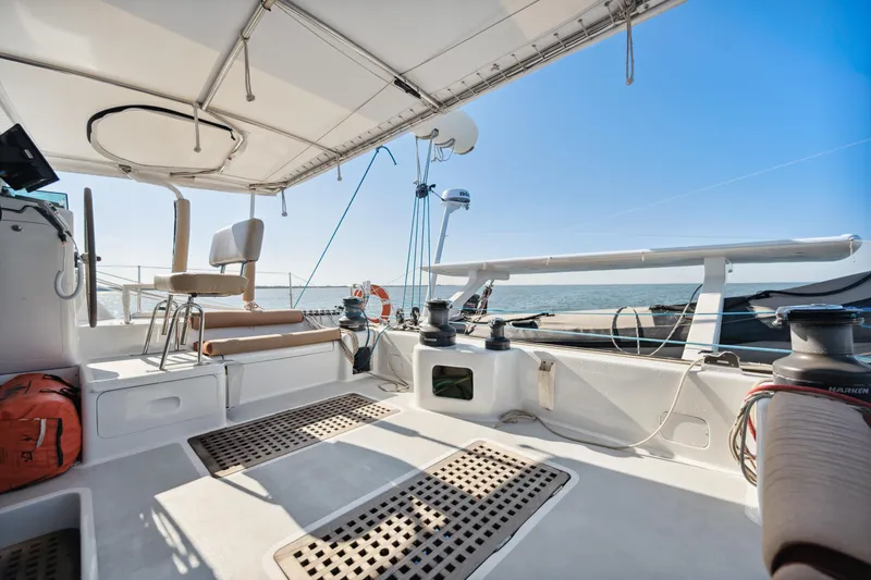 Slide: The Image of 1999 Technologie Marine Entincelle 60 yacht deck with seating and ocean view. - 26