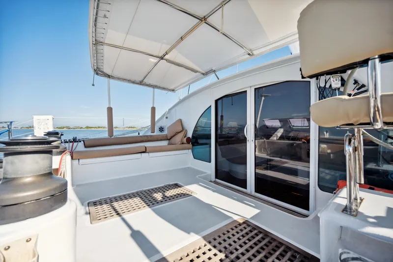 Slide: The Image of Deck view of 1999 Technologie Marine Entincelle 60 catamaran with seating and canopy. - 27