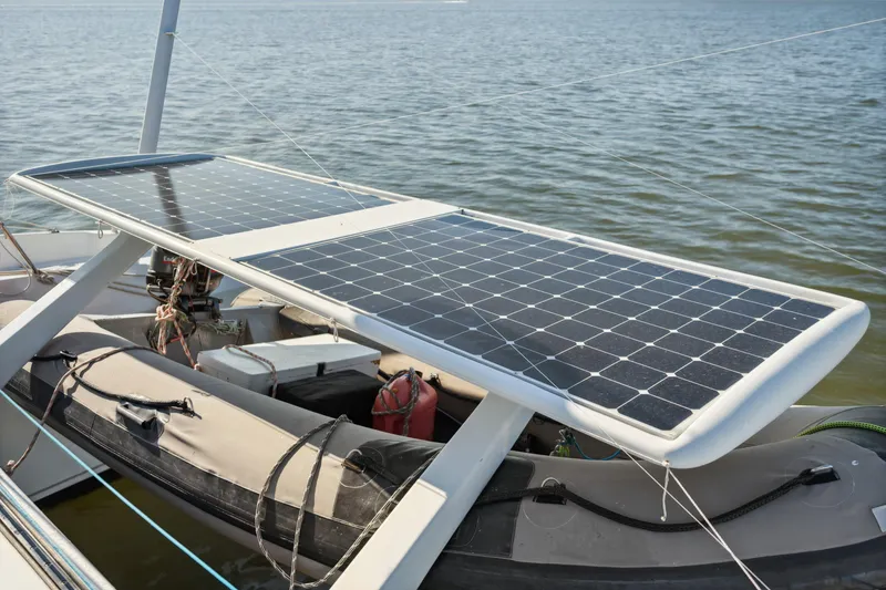 Slide: The Image of Solar panels on a 1999 Technologie Marine Entincelle 60 boat, floating on water. - 31