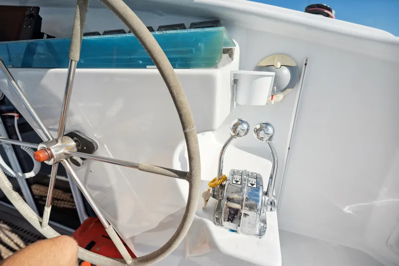 Slide: The Image of Steering wheel and controls of a 1999 Technologie Marine Entincelle 60 yacht. - 41