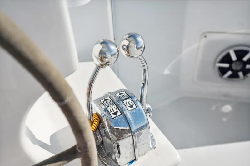 Slide: The Image of Close-up of 1999 Technologie Marine Entincelle 60 boat controls and steering wheel. - 42