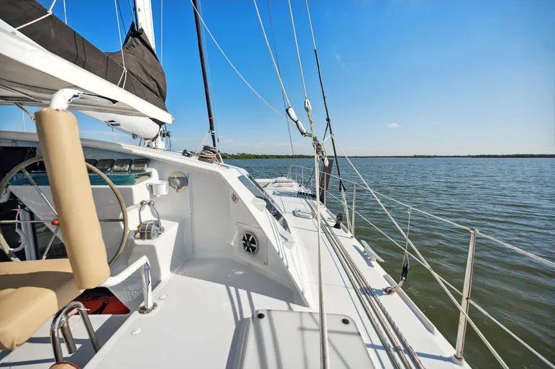 Slide: The Image of Sailing yacht Technologie Marine Entincelle 60, 1999 model, on calm waters under clear blue sky. - 48
