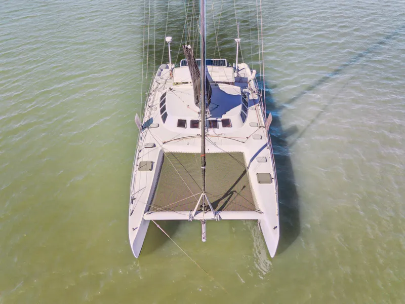 Slide: The Image of Aerial view of 1999 Technologie Marine Entincelle 60 catamaran on calm water. - 8