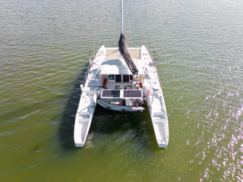 Slide: The Image of Catamaran Technologie Marine Entincelle 60, 1999 model, sailing on calm waters. - 9