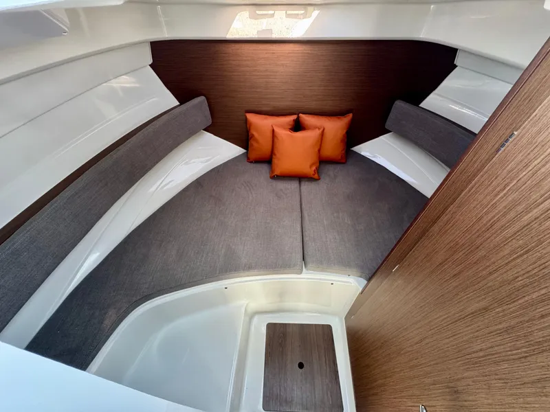 Slide: The Image of 2025 Beneteau Antares 8 cabin interior with cushions, modern design. - 10