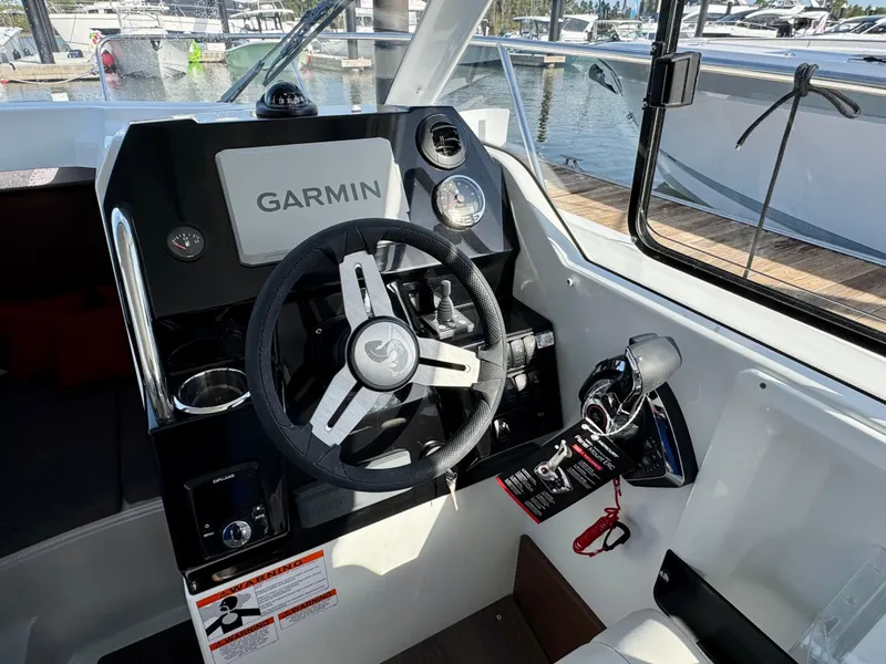 Slide: The Image of 2025 Beneteau Antares 8 helm with Garmin navigation system and modern controls. - 6