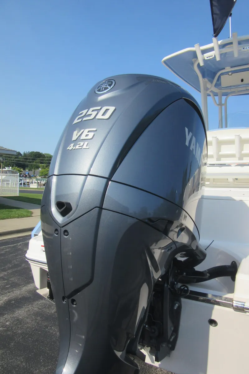 Slide: The Image of 2023 Robalo R230 Center Console with Yamaha 250 V6 outboard engine. - 2