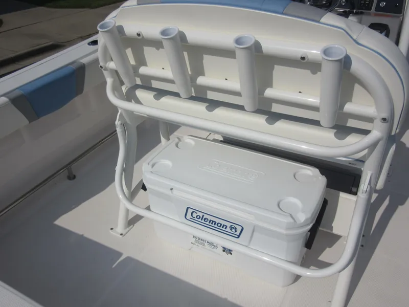 Slide: The Image of 2023 Robalo R230 Center Console boat with rod holders and Coleman cooler. - 31