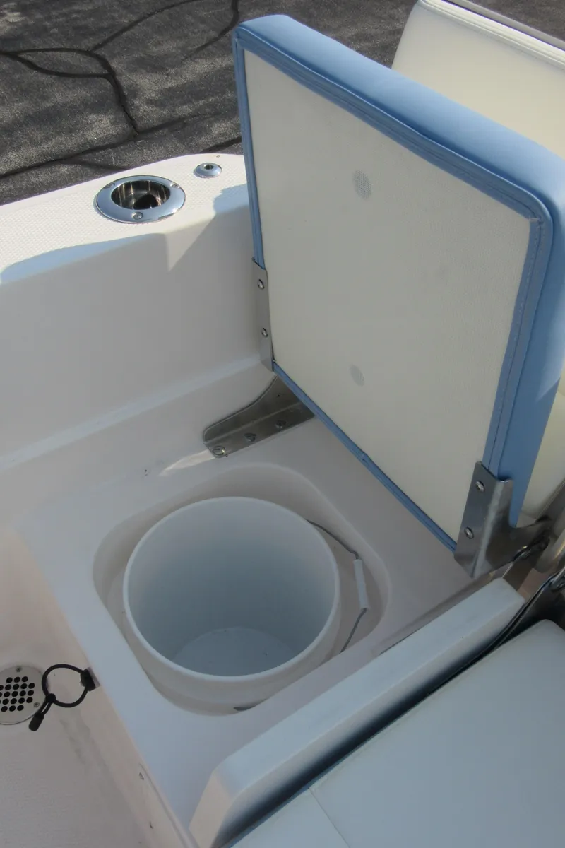 Slide: The Image of 2023 Robalo R230 Center Console boat seat with storage compartment. - 38