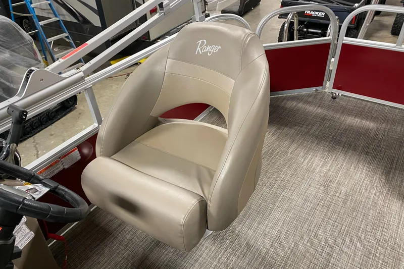 Slide: The Image of Captain's chair in a 2022 Ranger 200C boat, featuring beige upholstery and ergonomic design. - 11