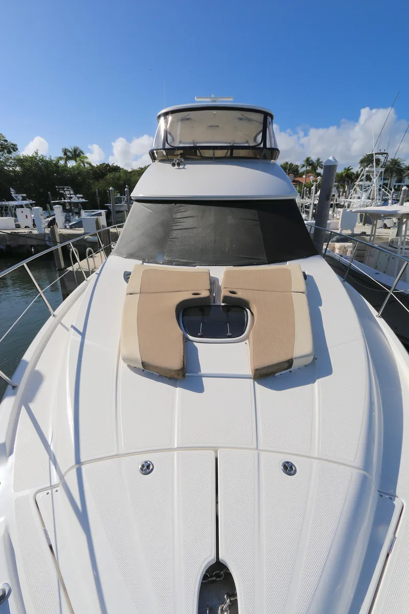 Slide: The Image of 2013 Meridian 441 Sedan yacht with sun deck, docked at marina. - 18