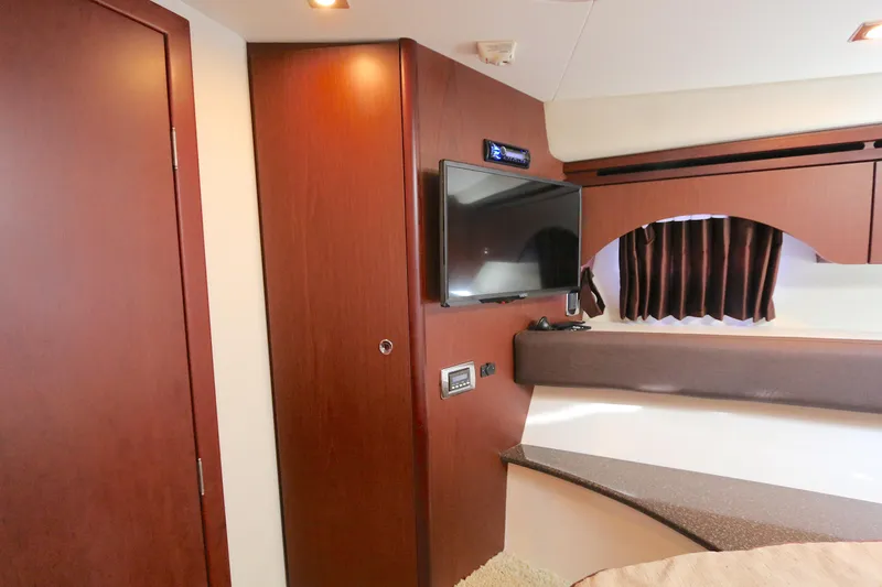 Slide: The Image of Interior of 2013 Meridian 441 Sedan with wood paneling and mounted TV. - 6