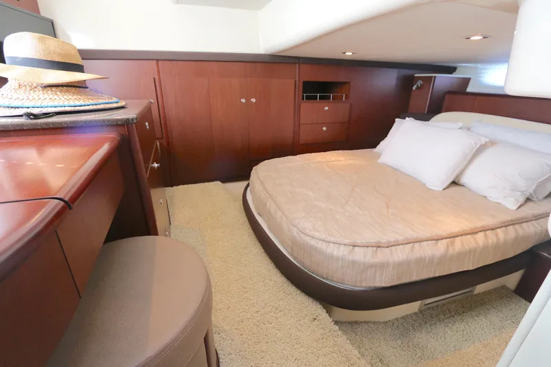 Slide: The Image of Luxurious bedroom interior of 2013 Meridian 441 Sedan yacht with elegant wood finish. - 8