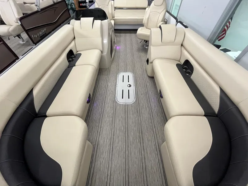 Slide: The Image of 2023 Premier 250 Sunsation boat interior with beige and black seating. - 4