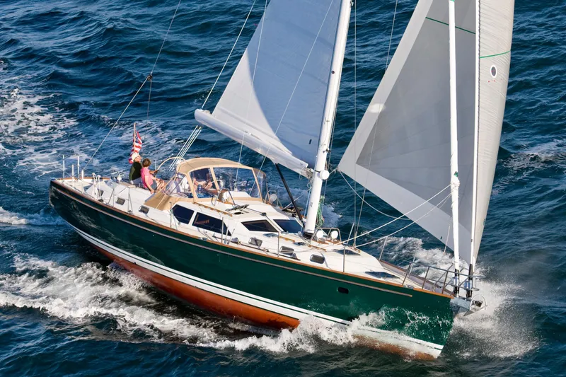 Slide: The Image of Sailing yacht Tartan 5300, 2026 model, navigating ocean waters with full sails. - 0