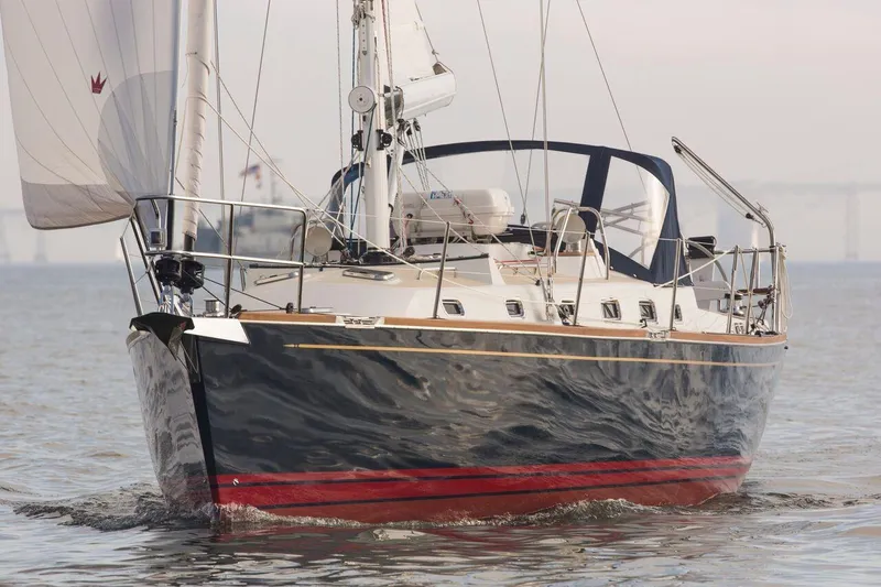 Slide: The Image of 2025 Tartan 395 sailboat cruising on calm waters. - 2