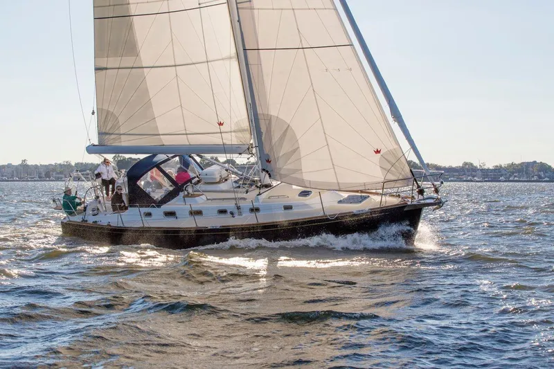 Slide: The Image of Sailing yacht Tartan 395, 2025 model, cruising on open water. - 2