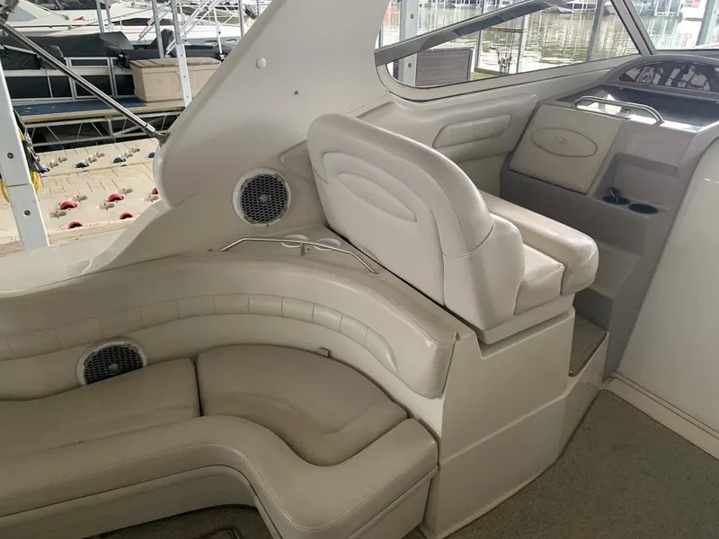 Slide: The Image of 1999 Regal 402 boat interior with white leather seating and dashboard. - 21