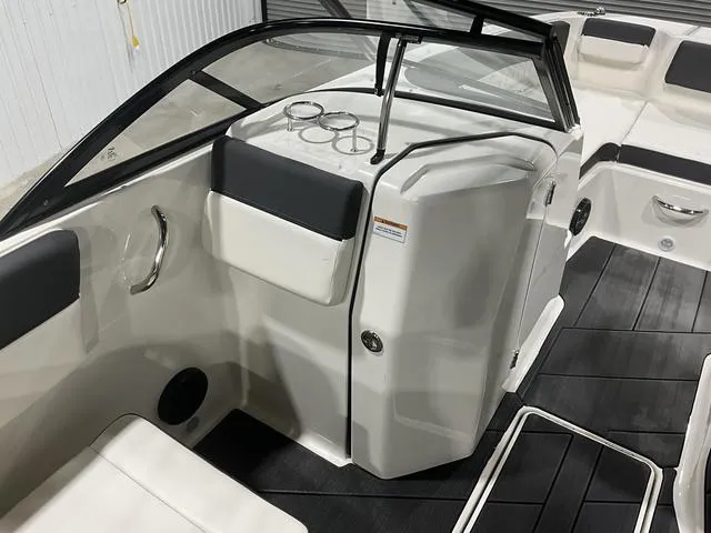 Slide: The Image of 2023 Bayliner DX2250 boat interior with sleek seating and modern design. - 15