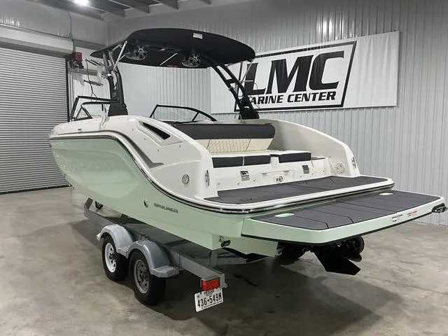 Slide: The Image of 2023 Bayliner DX2250 boat on trailer at LMC Marine Center showroom. - 5