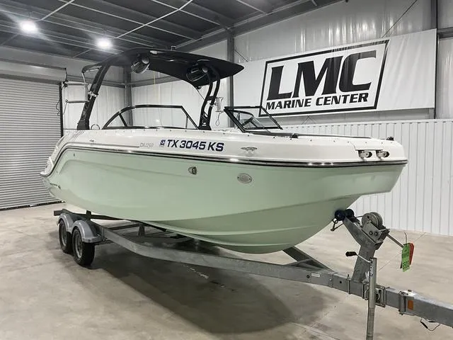 Slide: The Image of 2023 Bayliner DX2250 boat on trailer at LMC Marine Center showroom. - 7