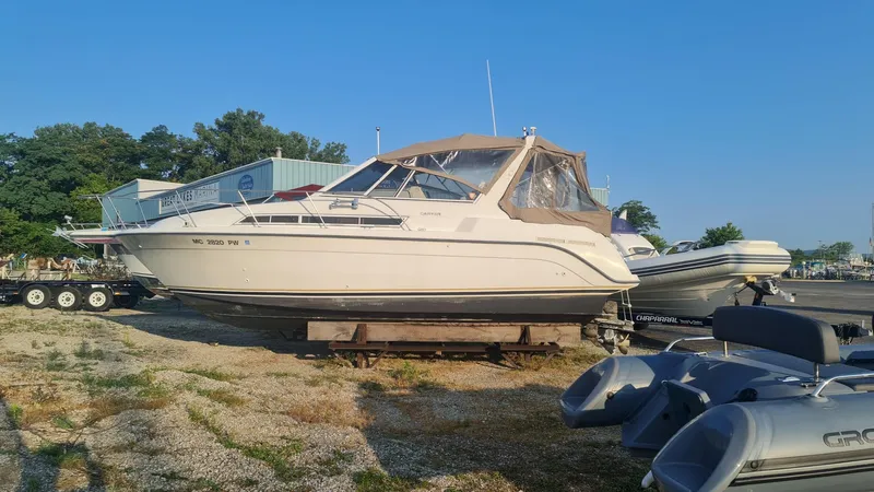 Slide: The Image of 1995 Carver 528 Montego boat on a dry dock. - 1