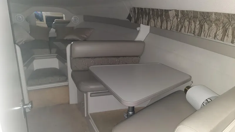 Slide: The Image of Interior of 1995 Carver 528 Montego with seating area and table. - 13