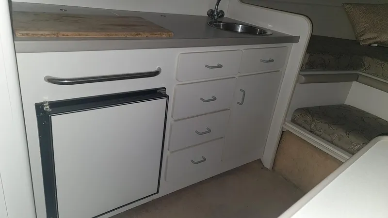 Slide: The Image of 1995 Carver 528 Montego boat interior kitchen area. - 16