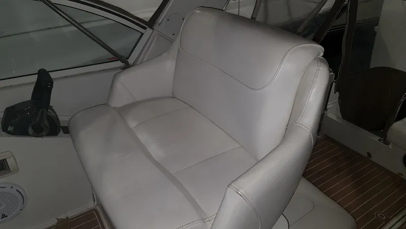 Slide: The Image of Interior of a 1995 Carver 528 Montego with white seating. - 9